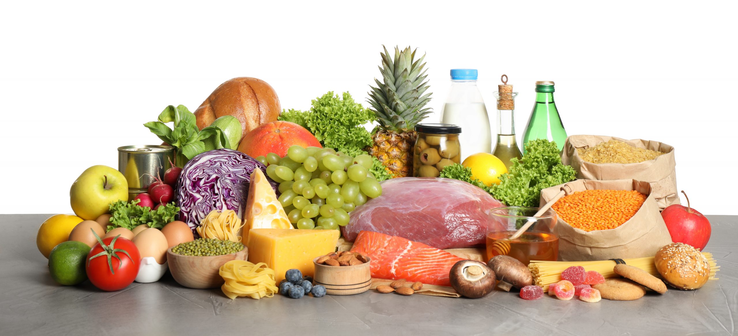 Different products on grey table. Healthy food and balanced diet